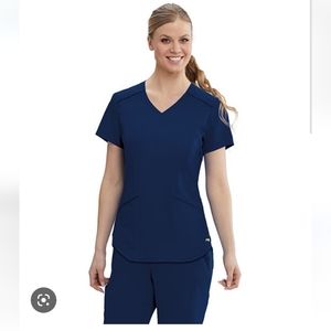 6 scrub tops, 3 scrub pants. Size small/ XS